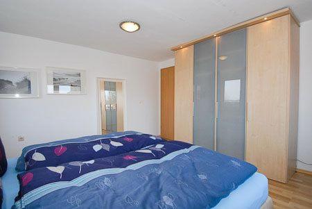 Postel nebo postele na pokoji v ubytování Haus Hafenblick