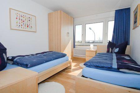 Postel nebo postele na pokoji v ubytování Haus Hafenblick