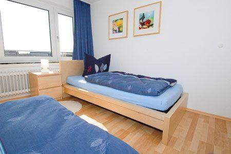 Postel nebo postele na pokoji v ubytování Haus Hafenblick