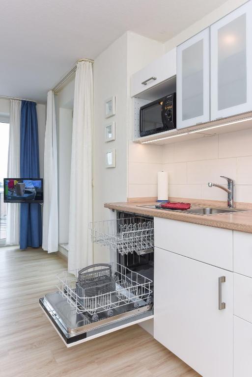 Kuchyň nebo kuchyňský kout v ubytování Haus Hafenblick