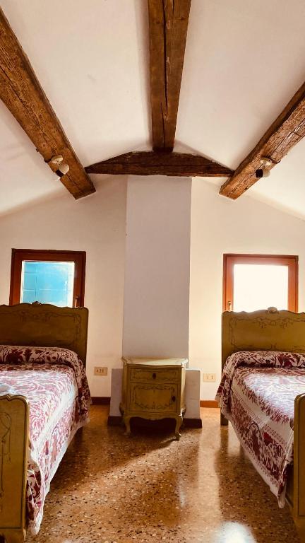 A bed or beds in a room at Cà Sardi