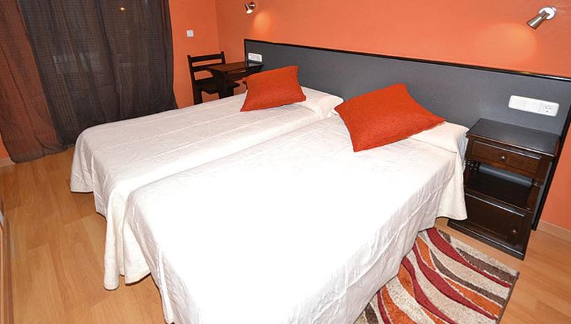 Postel nebo postele na pokoji v ubytování Apartamentos Turisticos Dormi2