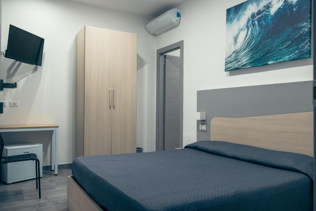 Posteľ alebo postele v izbe v ubytovaní BluMarine Appartaments