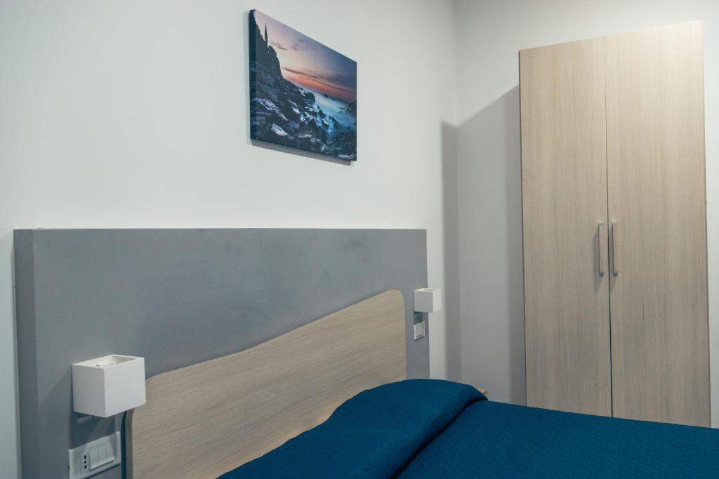 Posteľ alebo postele v izbe v ubytovaní BluMarine Appartaments