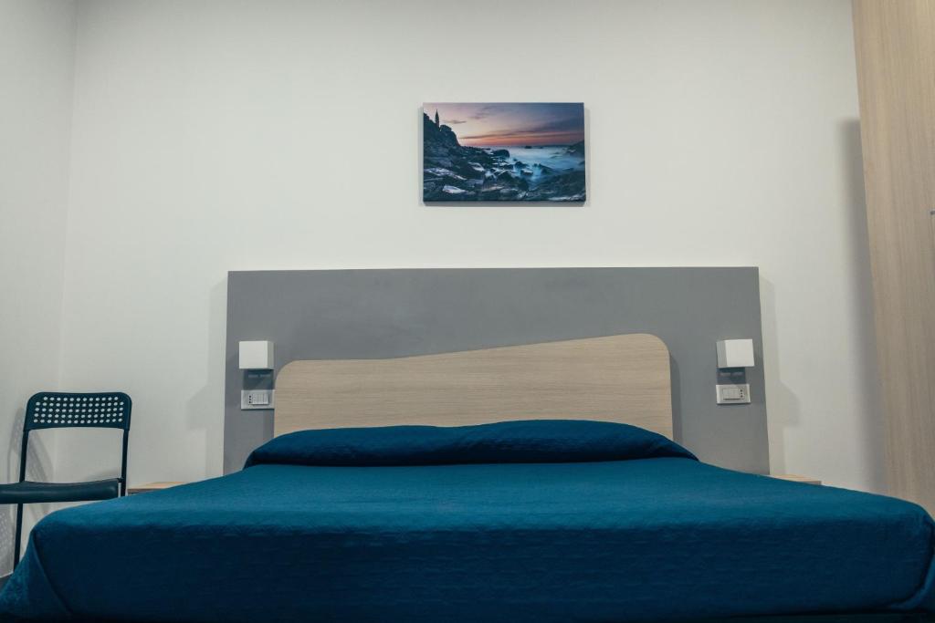 Posteľ alebo postele v izbe v ubytovaní BluMarine Appartaments