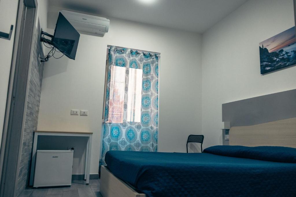 Posteľ alebo postele v izbe v ubytovaní BluMarine Appartaments