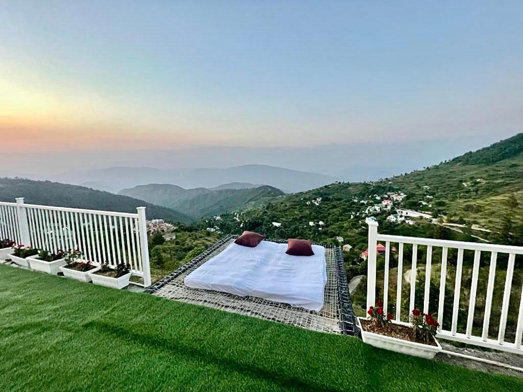 a balcony with a view of a mountain at Villa MYSA in Rāmgarh