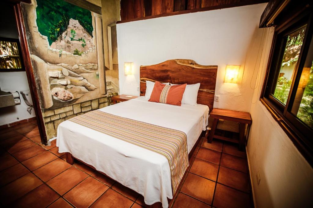 Postel nebo postele na pokoji v ubytování Hotel Rancho Encantado