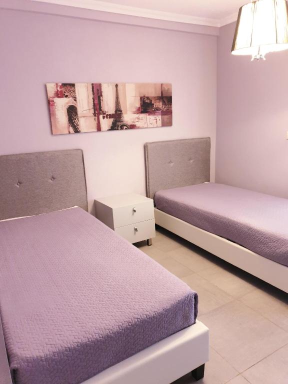 Postel nebo postele na pokoji v ubytování Ocean Beach Hotel