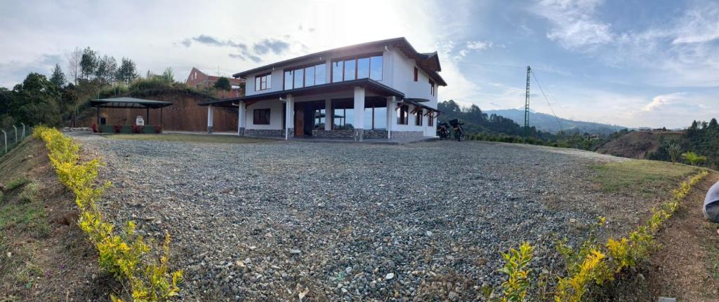 a house on the side of a gravel road at Hermosa vista GH #4 in Guarne