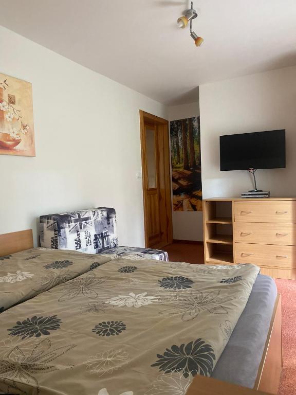 Łóżko lub łóżka w pokoju w obiekcie Pension Sima