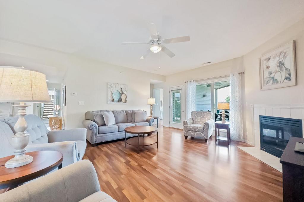 a living room with a couch and a fireplace at Regatta Retreat in Lake Ozark