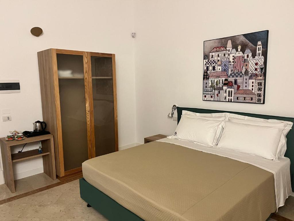 Postel nebo postele na pokoji v ubytování VIANNA SUITES SPA