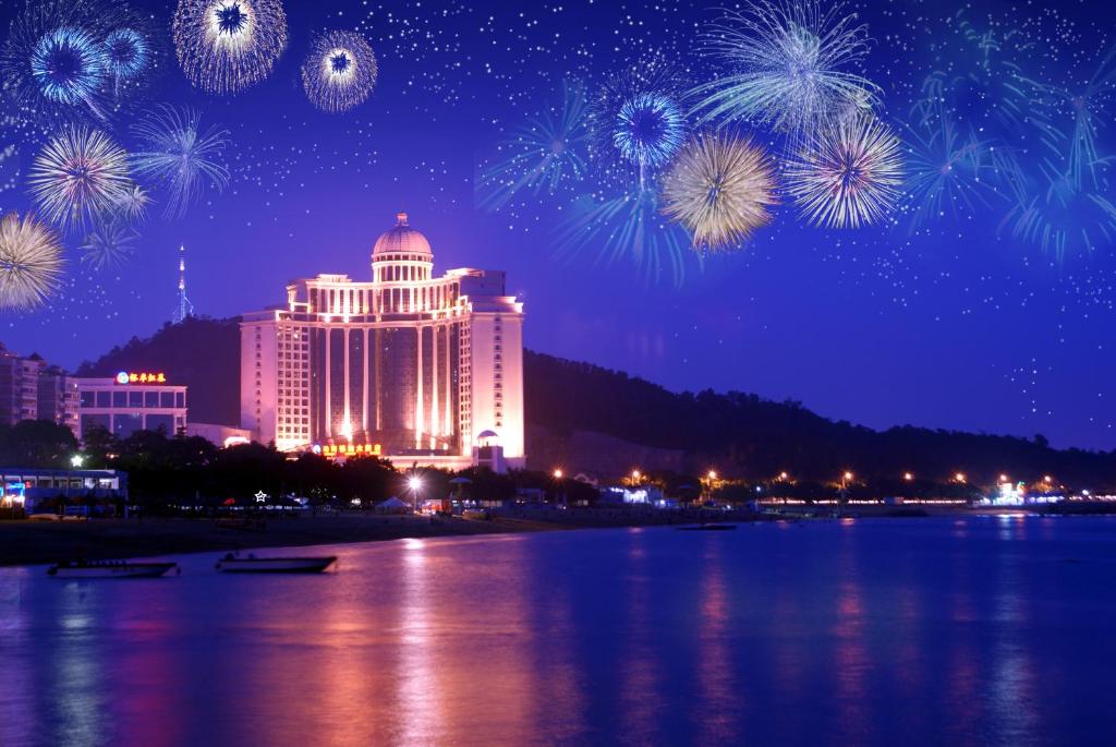 a view of a city with fireworks in the sky at Zhuhai Dehan Hotel in Zhuhai
