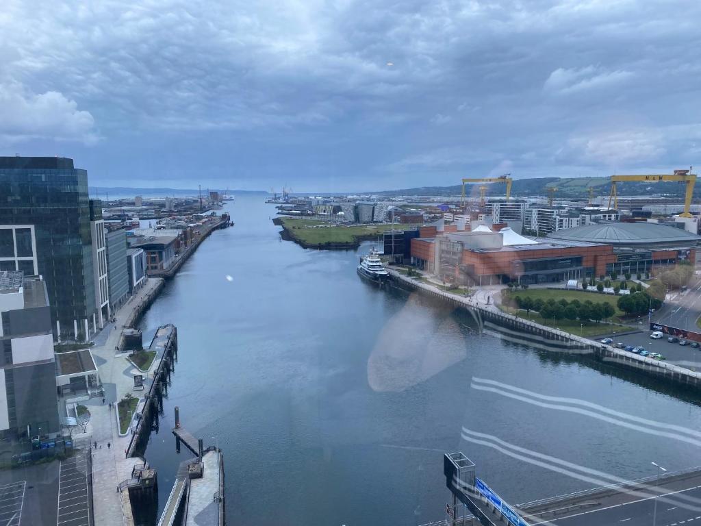 a view of a river in a city at Titanic and Sea View Belfast 2 bedroom Apartment City Centre in Belfast