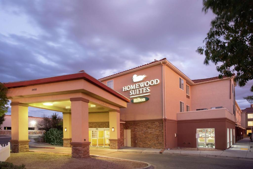 a front view of a holiday inn suites at Homewood Suites by Hilton Albuquerque-Journal Center in Albuquerque