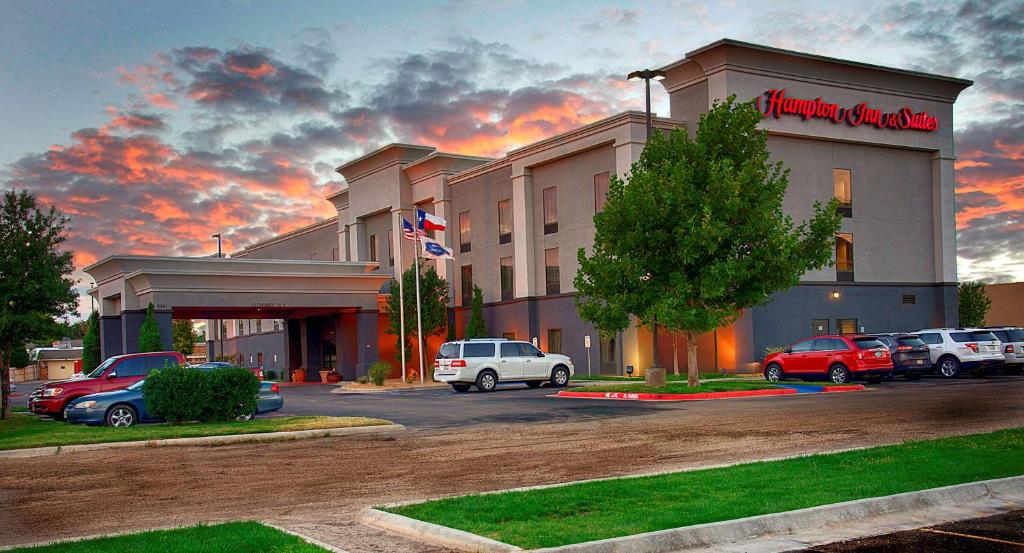 a hotel with cars parked in a parking lot at Hampton Inn and Suites Amarillo West in Amarillo