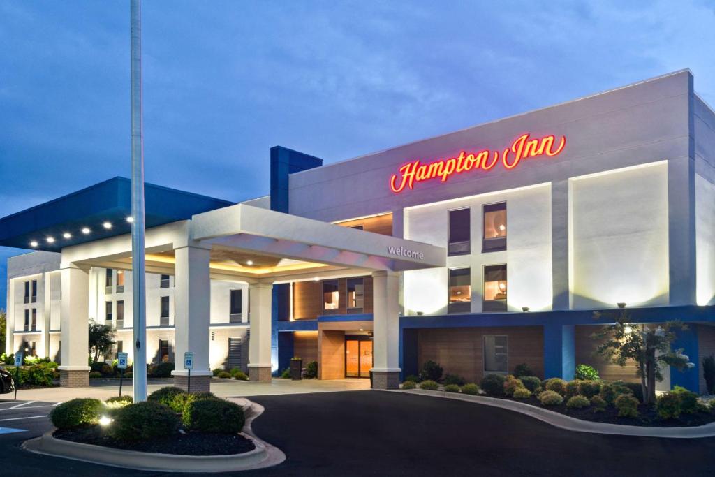 a building with a sign on the side of it at Hampton Inn Anderson in Anderson