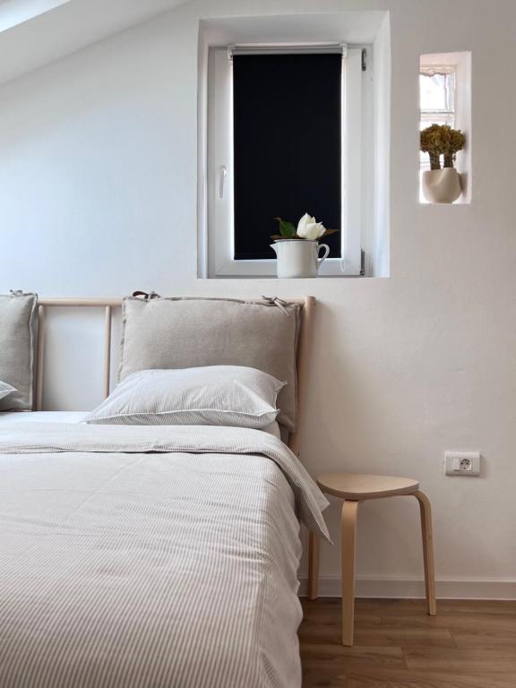 Łóżko lub łóżka w pokoju w obiekcie Apartments Forum 2