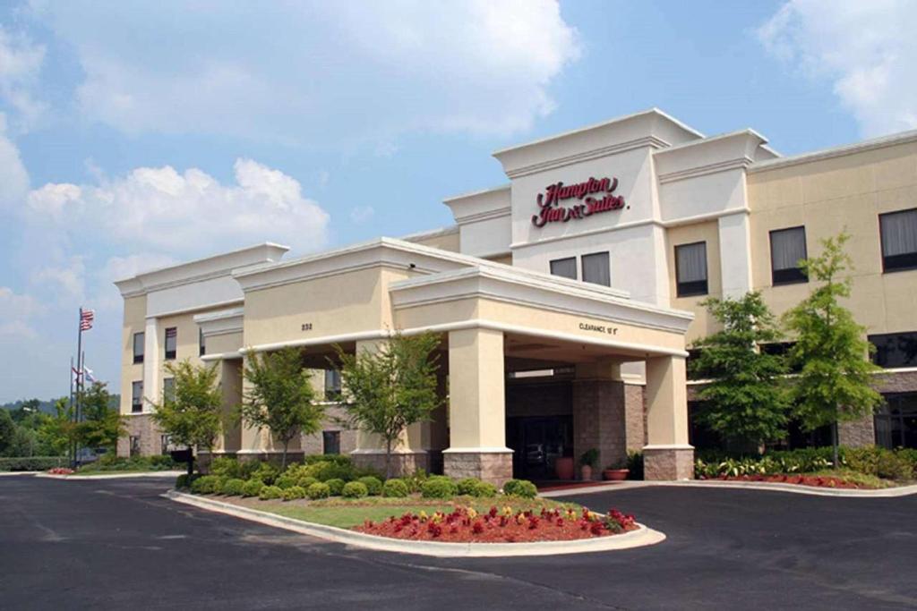 a hotel with a sign on the front of it at Hampton Inn & Suites Birmingham-Pelham - I-65 in Pelham
