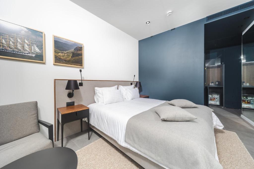 Postel nebo postele na pokoji v ubytování Boutique Hotel Shell