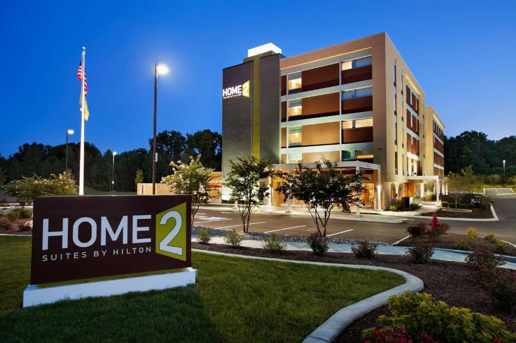 a home suites by hilton sign in front of a building at Home2 Suites Nashville Airport in Nashville