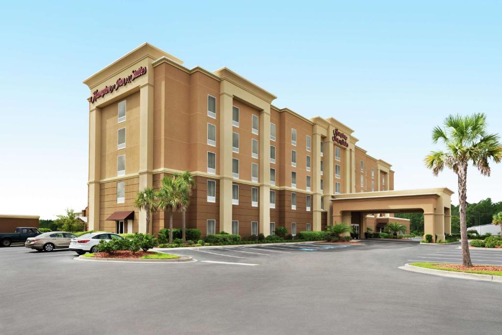 a rendering of a hotel with a parking lot at Hampton Inn & Suites Brunswick in Brunswick