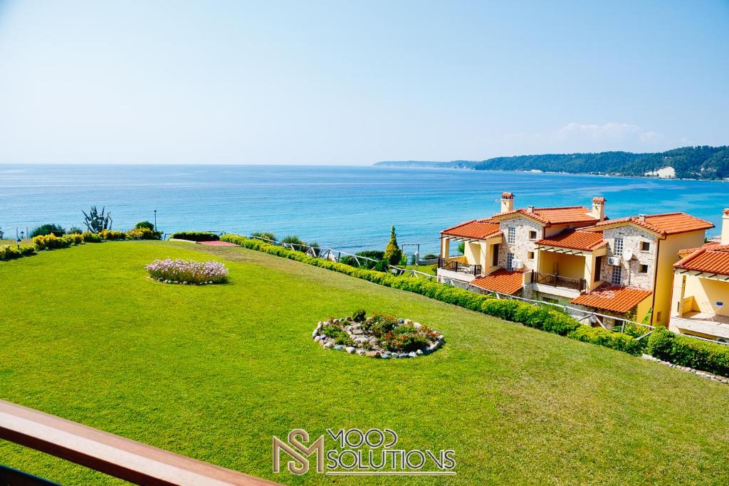 an aerial view of a house with a green lawn at Aiolis Fourka MoodSolutions Living in Skála Foúrkas