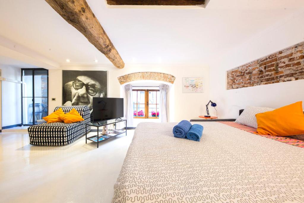 A bed or beds in a room at Loft La Città Vecchia
