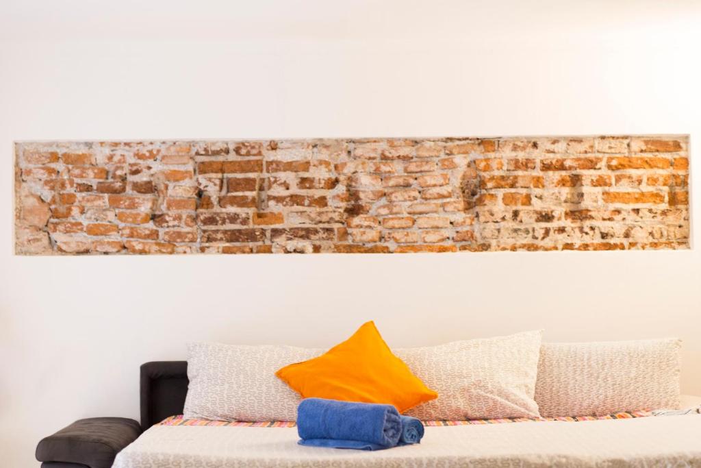 A bed or beds in a room at Loft La Città Vecchia