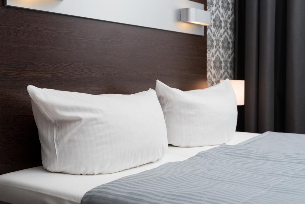 Postel nebo postele na pokoji v ubytování Hotel Munich Inn - Design Hotel