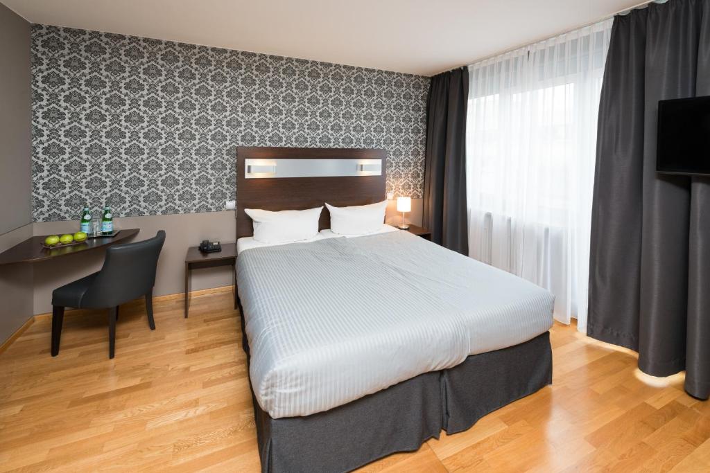 Postel nebo postele na pokoji v ubytování Hotel Munich Inn - Design Hotel