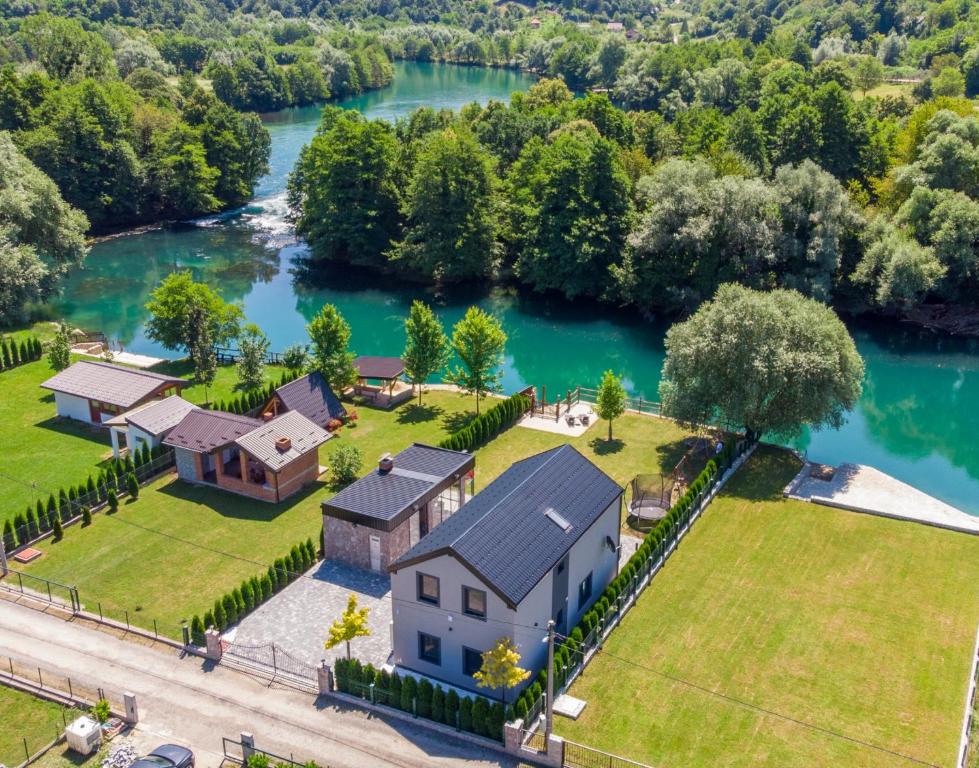 an aerial view of a house next to a river at Villa UNA LUX in Bihać