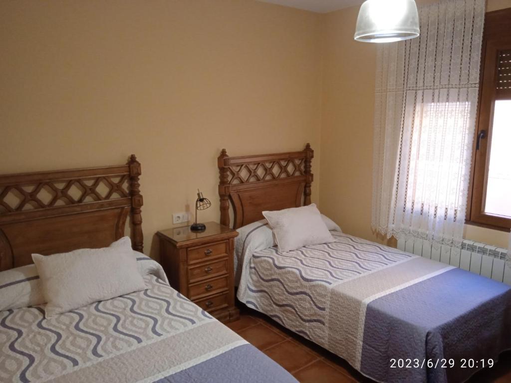 Postel nebo postele na pokoji v ubytování Casa Rural Señorio de Quevedo