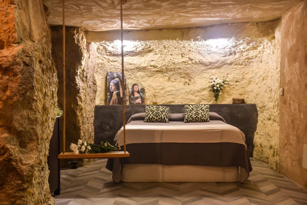 En eller flere senger på et rom på Gaia Resort - Cueva las reinas