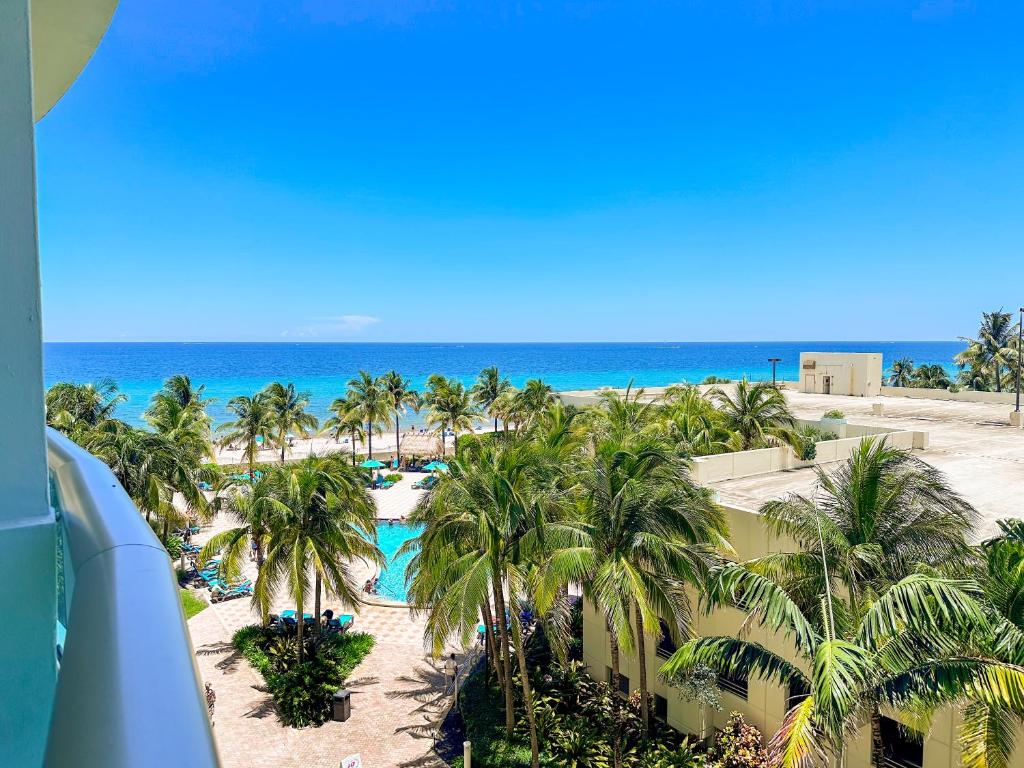 a view of the beach from the balcony of a resort at Modern 1 BDR Oceanview with direct beach access! in Hollywood