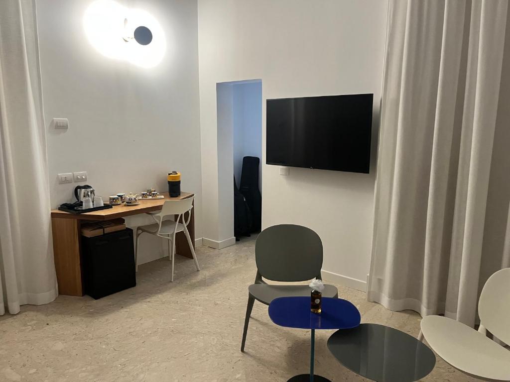 TV a/nebo společenská místnost v ubytování VIANNA SUITES SPA