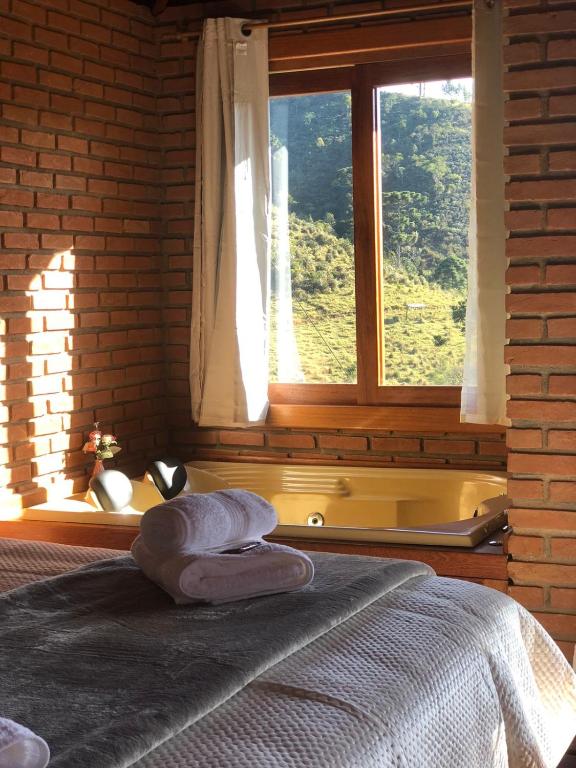 Postel nebo postele na pokoji v ubytování Recanto João de barro