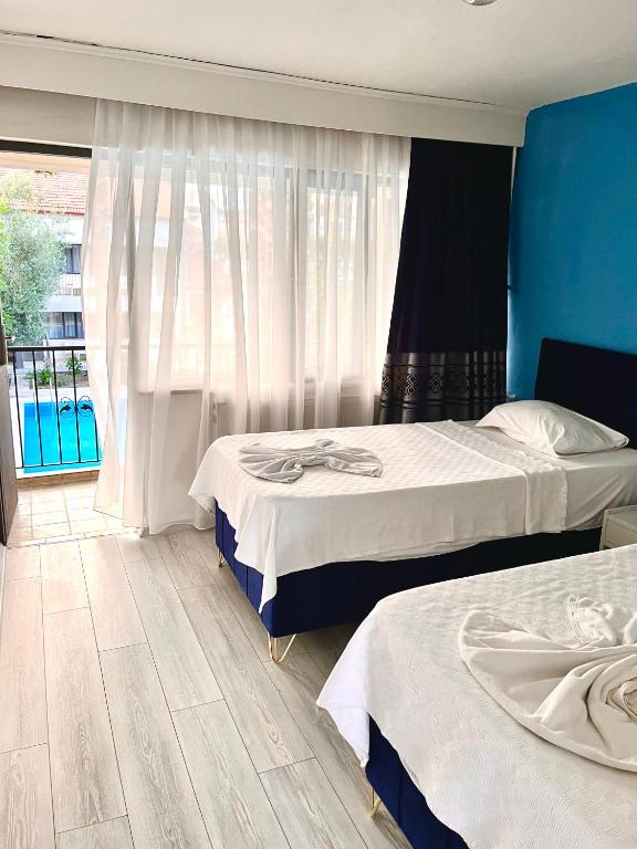 Postel nebo postele na pokoji v ubytování Artemis Yörük Hotel - Pamukkale Denizli