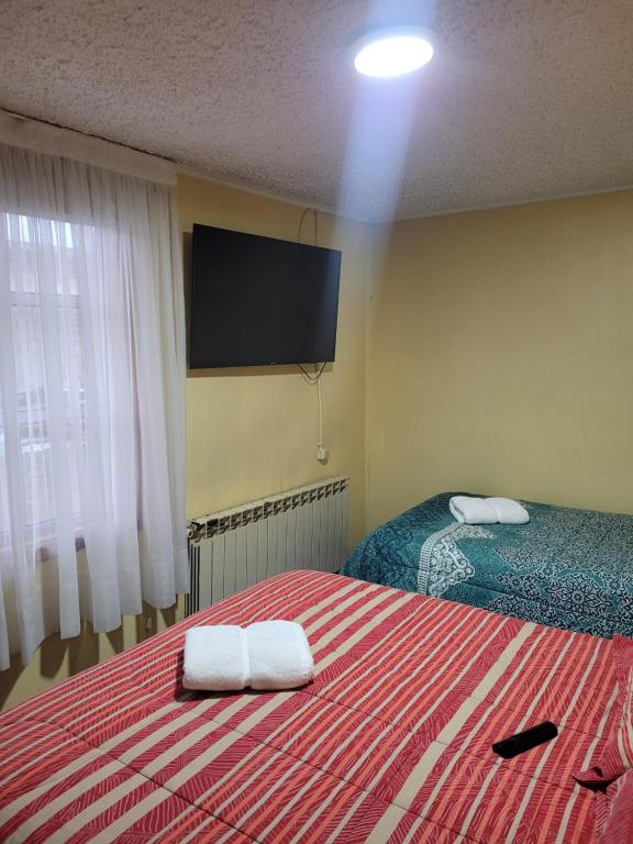 Letto o letti in una camera di Hostal Balmaceda