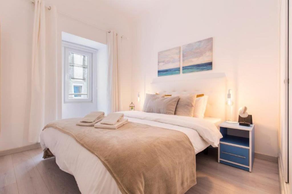 Ένα ή περισσότερα κρεβάτια σε δωμάτιο στο A Casa do Jamor