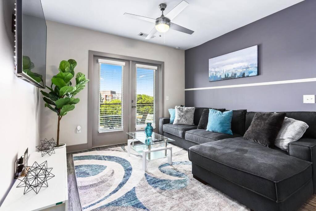 a living room with a couch and a table at Luxury Buckhead Apartment in Atlanta