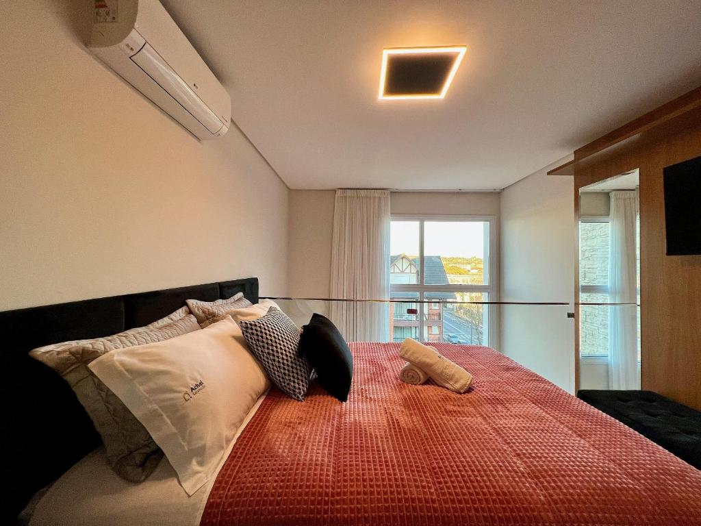 Katil atau katil-katil dalam bilik di Maravilhoso Loft 235 1 Suíte Centro by Achei