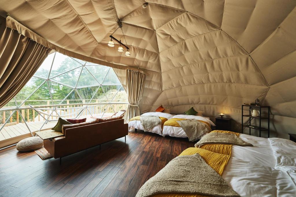 Postel nebo postele na pokoji v ubytování GLAMPING GATE 奈良