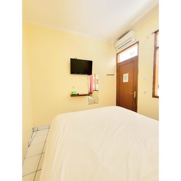 TV a/nebo společenská místnost v ubytování Teratai Residence