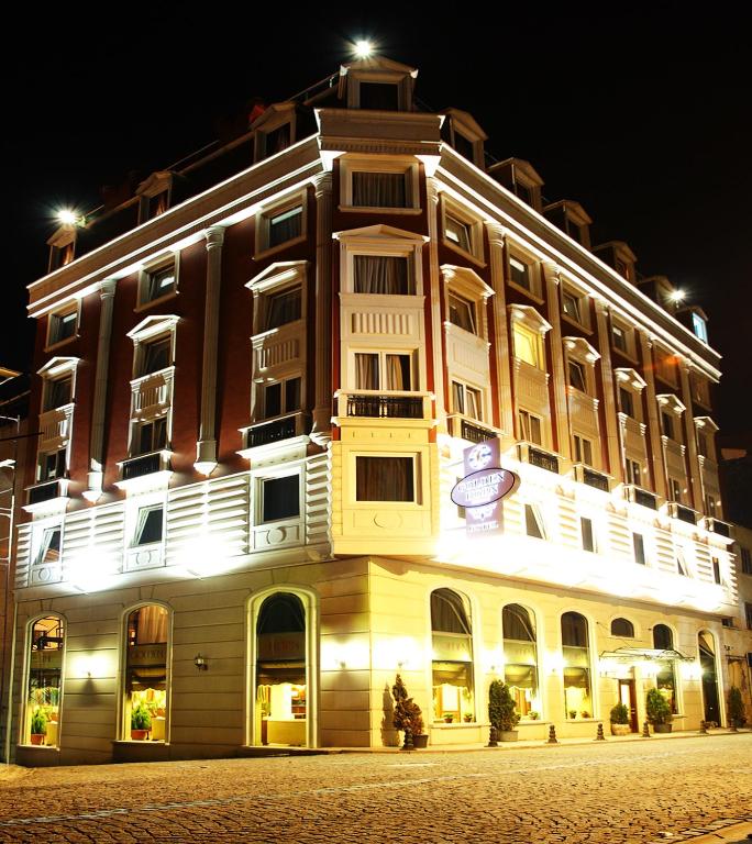 a large building is lit up at night at Golden Horn Hotel in Istanbul