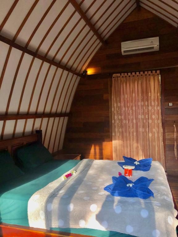 Postel nebo postele na pokoji v ubytování Blue Moon Meno