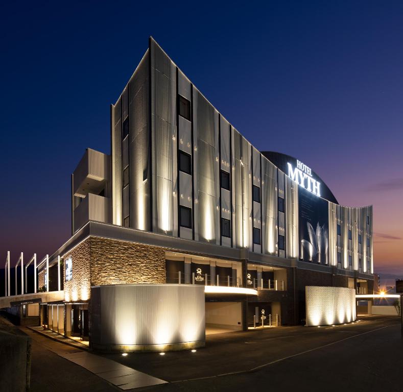 a building with a sign on it at night at HOTEL MYTH-U -Adult only in Wakayama