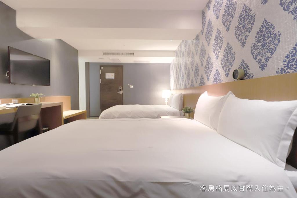 Postel nebo postele na pokoji v ubytování Talmud Hotel Yizhong