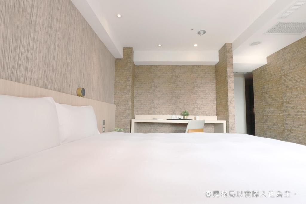 Postel nebo postele na pokoji v ubytování Talmud Hotel Yizhong